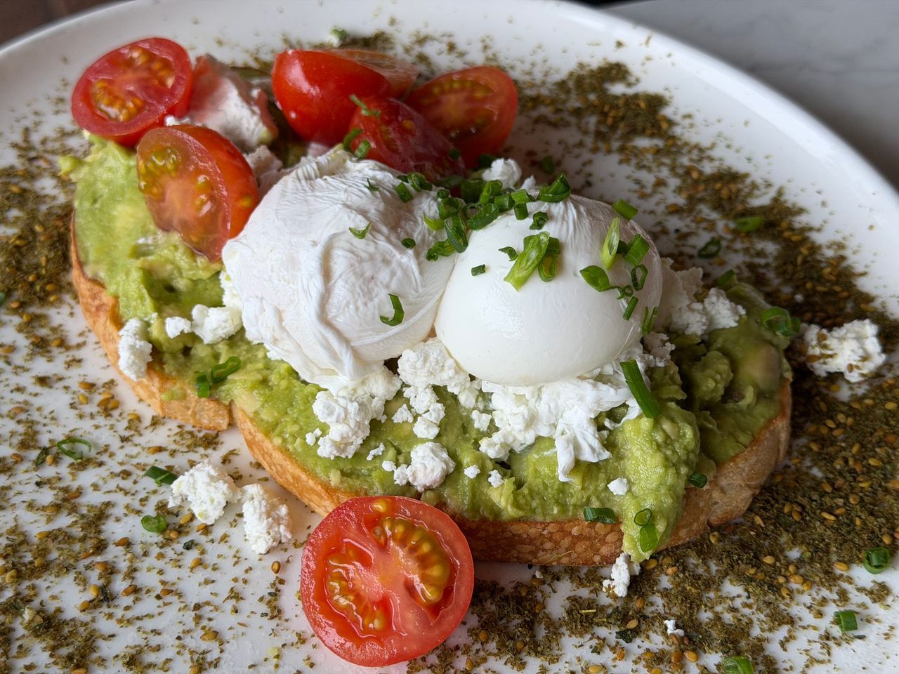 A warm bowl of seasoned lentils topped with a poached egg and crumbled feta provides fiber, protein, and comfort in one dish.