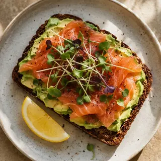 Whole-grain toast topped with silky smoked salmon and a smear of cream cheese is a savory, omega-3-rich start to the morning.