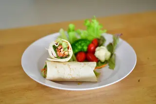 Wrap up a warm whole-wheat tortilla with turkey sausage, scrambled egg whites, and a handful of spinach for a satisfying on-the-go bite.